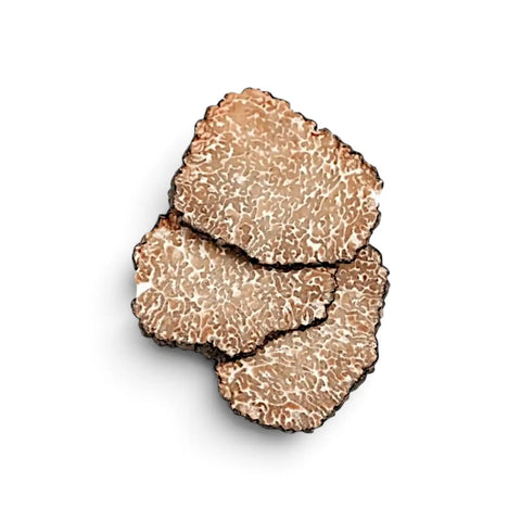 Dried truffle slices, truffle powder, morels and porcini arranged for culinary use