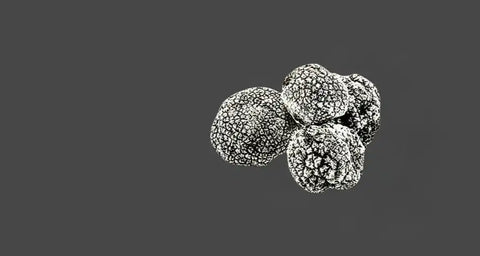 Black truffles with textured surface.
