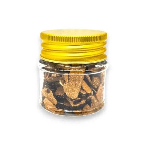 Brown truffle spice jar with yellow lid containing dried black summer truffle Tuber Aestivum